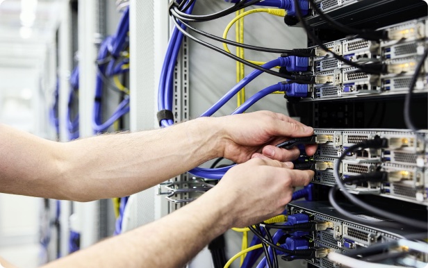 DALCO engineer cabling a server rack